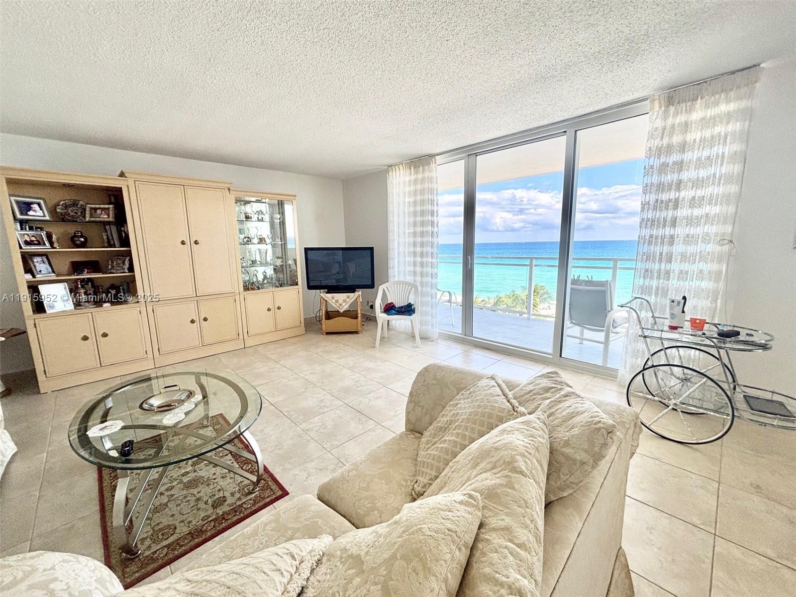 2030 South Ocean Drive, Unit 521 Hallandale Beach, FL 33009 - Photo 5 of 20 a bedroom with furniture and a large window