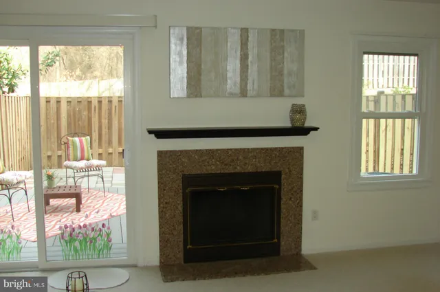 a living room with a couch and a fireplace