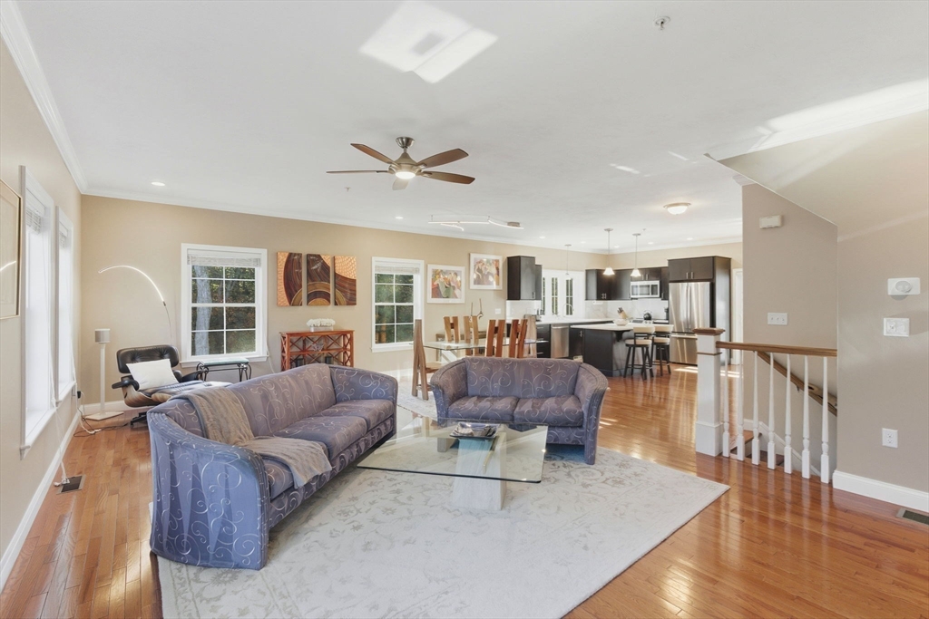 66 Compass Point, Unit 66 North Andover, MA 01845 - Photo 24 of 42 a living room with furniture and a large window