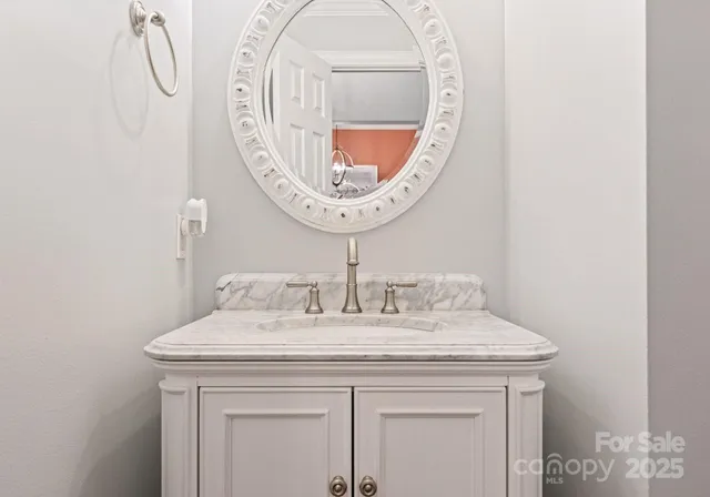 a spacious bedroom with a bed and a flat screen tv