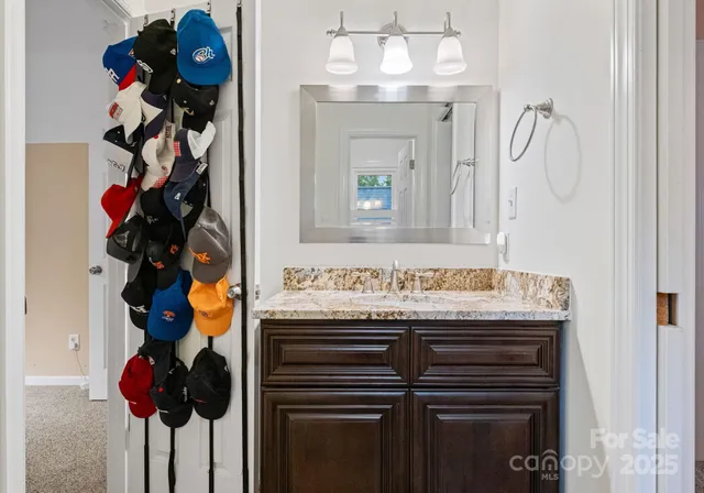 a bedroom with two beds and a chandelier