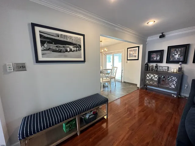 a view of a livingroom with furniture wooden floor and window