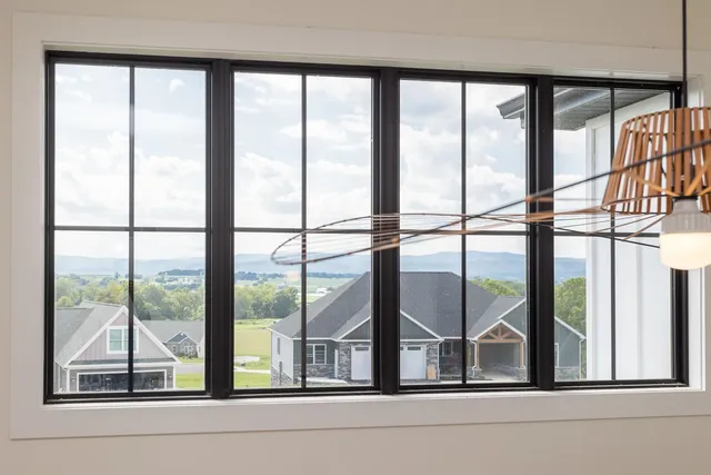 a view of walk in closet with clothes