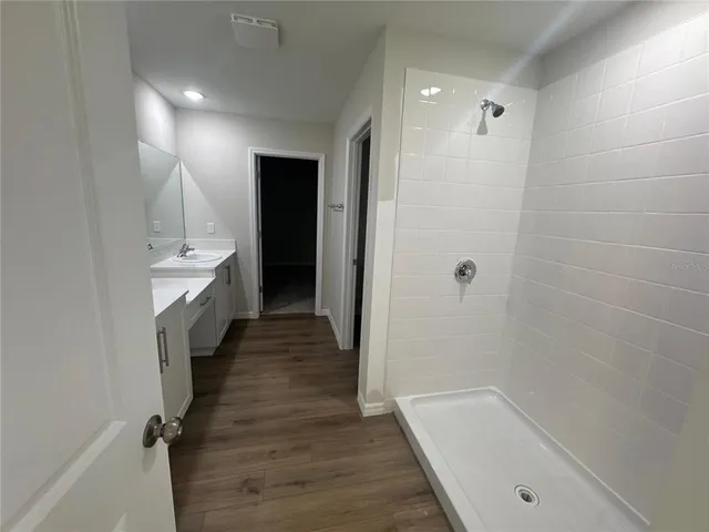 a bathroom with a bathtub and a shower