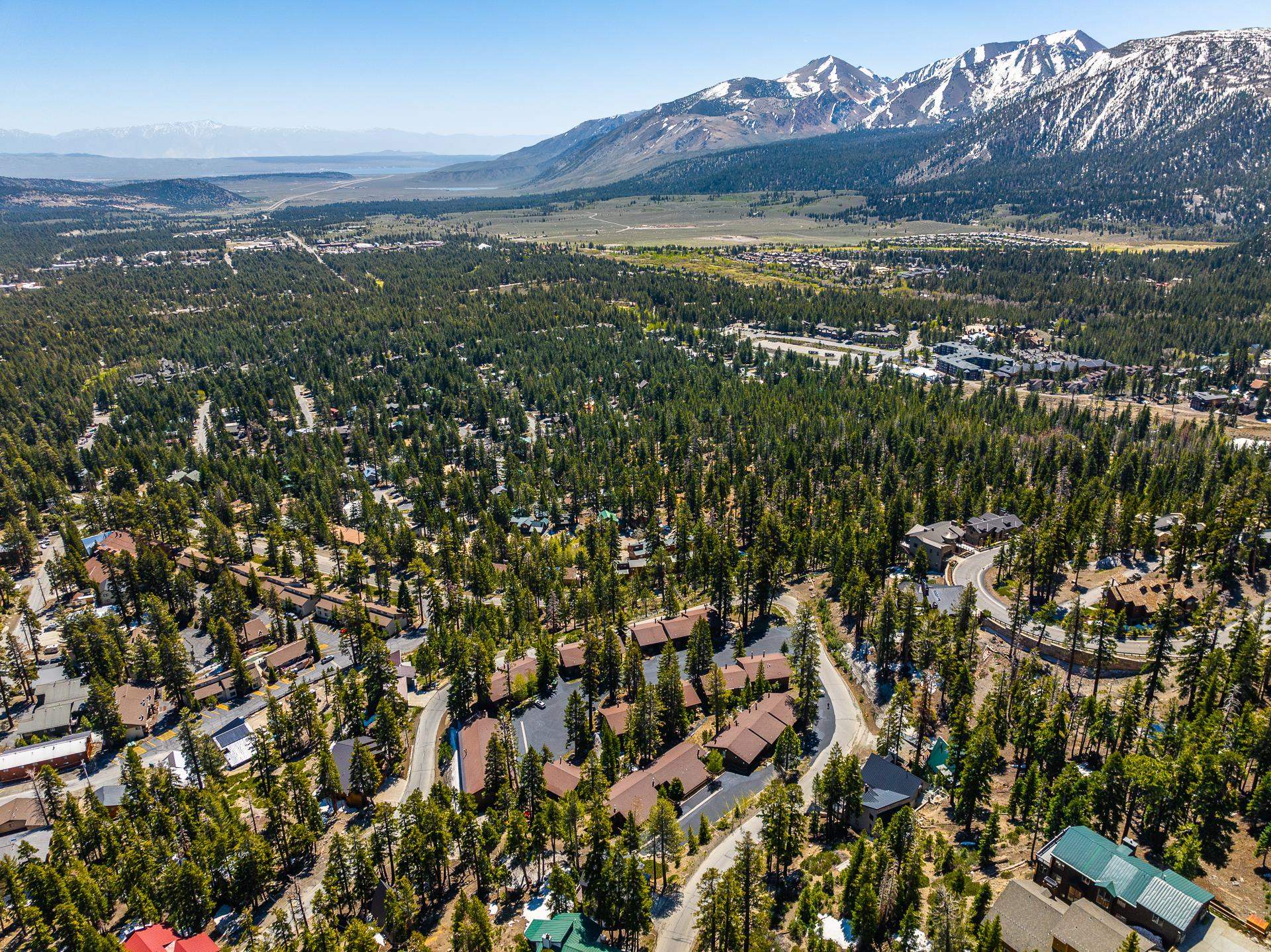94 John Muir Road, Unit 132 Mammoth Lakes, CA 93546 - Photo 48 of 58 Expansive aerial perspective showcasing a mountainous landscape with snow-capped peaks
