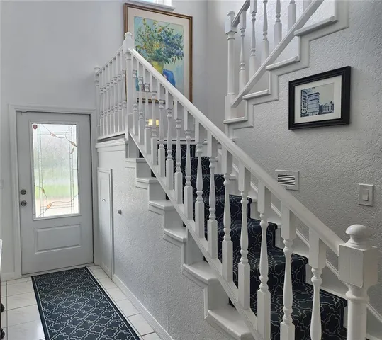 a view of an entryway with wooden floor