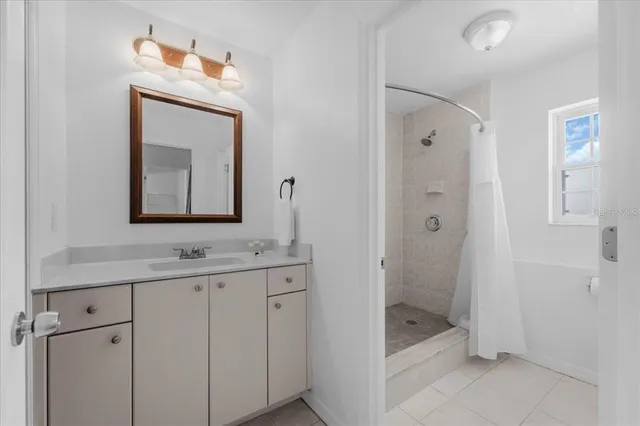 a bathroom with a toilet sink and shower