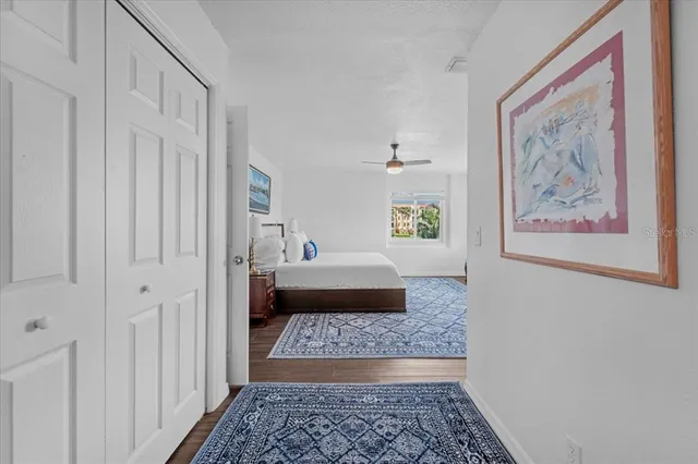 a bedroom with a rug and bed