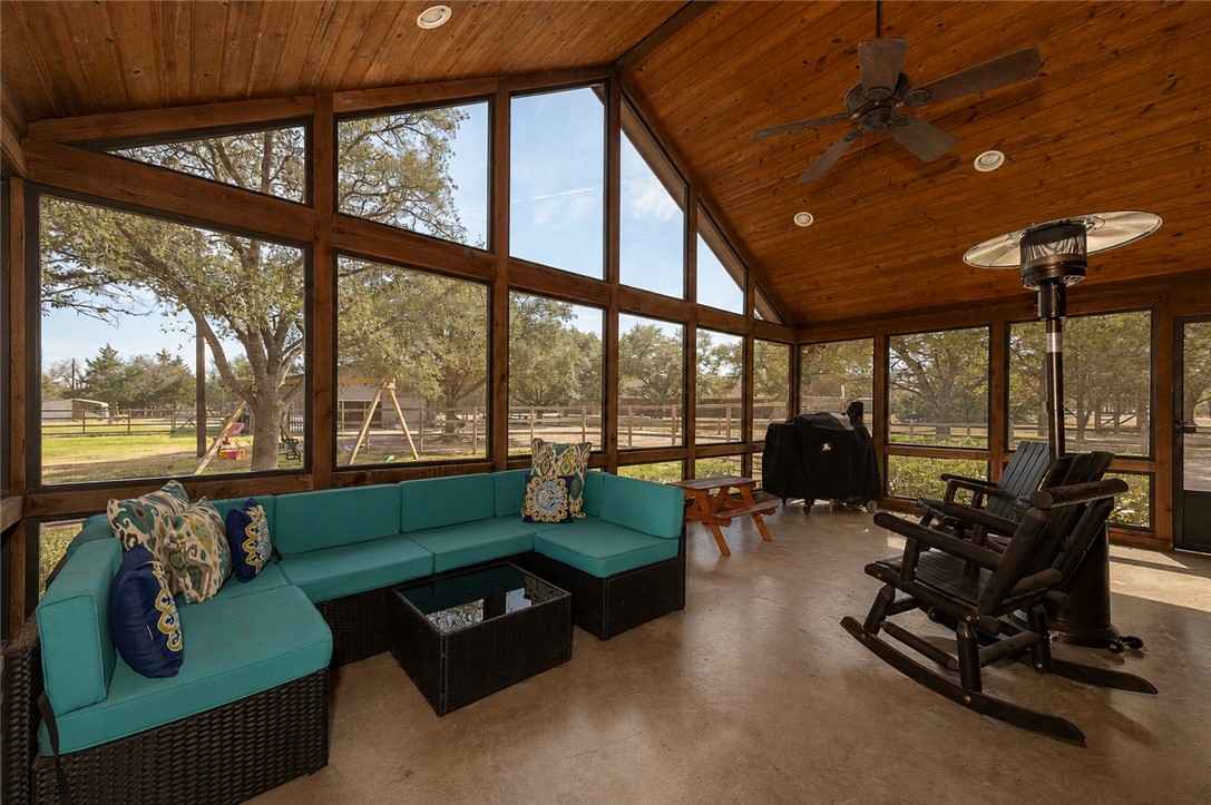 2302 Quail Run College Station, TX 77845 - Photo 5 of 49 a living room with furniture and floor to ceiling windows