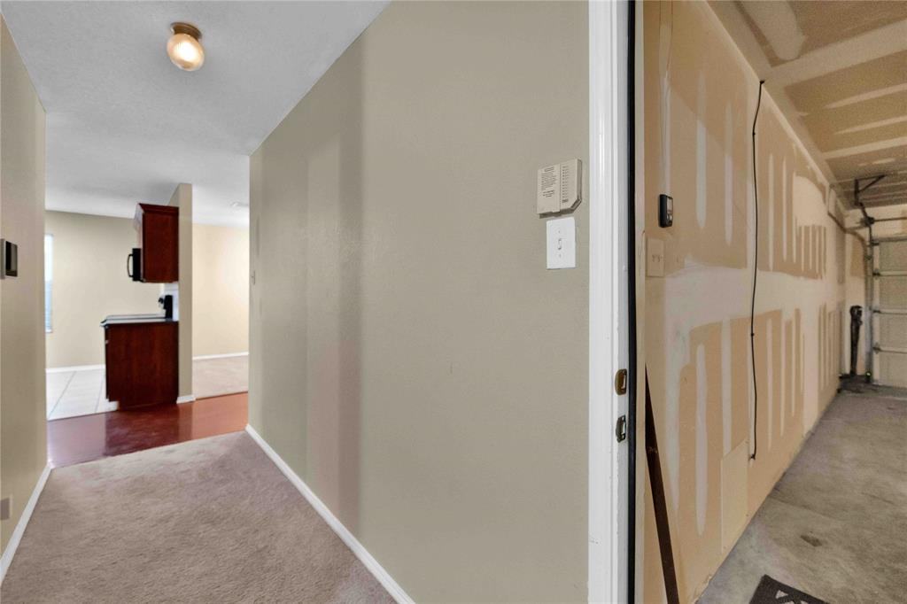9517 George Washington Drive McKinney, TX 75072 - Photo 18 of 31 a view of a hallway with a white walls