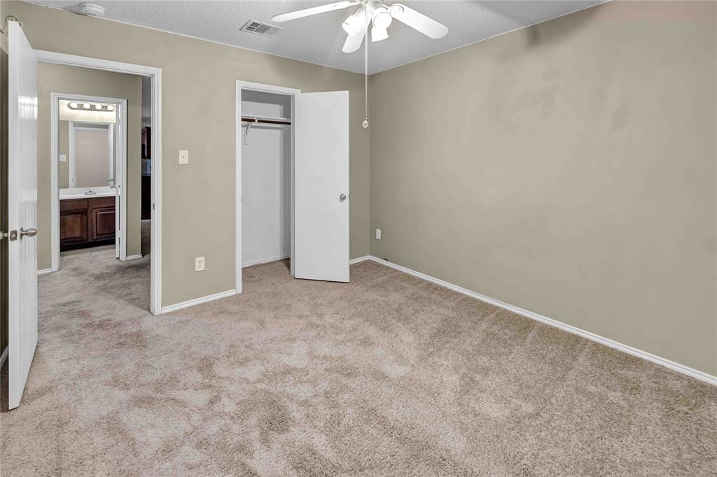 9517 George Washington Drive McKinney, TX 75072 - Photo 25 of 31 an empty room with a chandelier fan and windows
