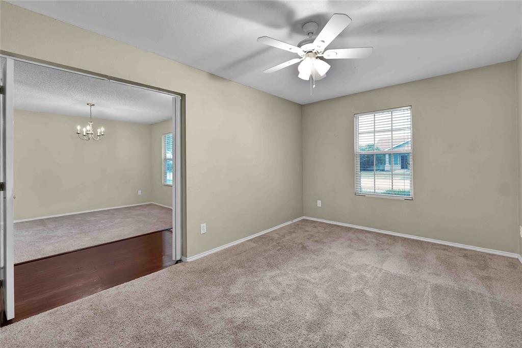 9517 George Washington Drive McKinney, TX 75072 - Photo 4 of 31 an empty room with windows and ceiling fan