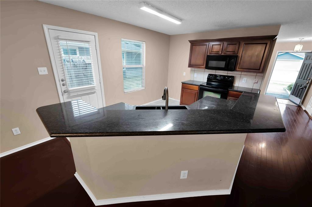 9517 George Washington Drive McKinney, TX 75072 - Photo 9 of 31 a view of kitchen with granite countertop window