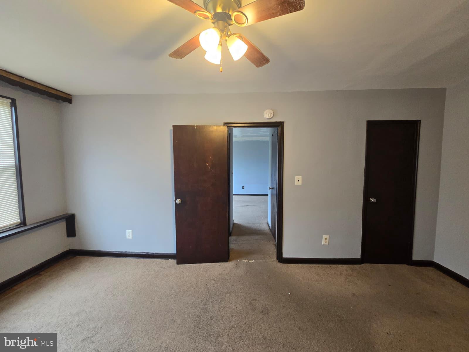 428 Ridge Road Southeast, Unit 305 Washington, DC 20019 - Photo 17 of 23 a view of an empty room with a ceiling fan