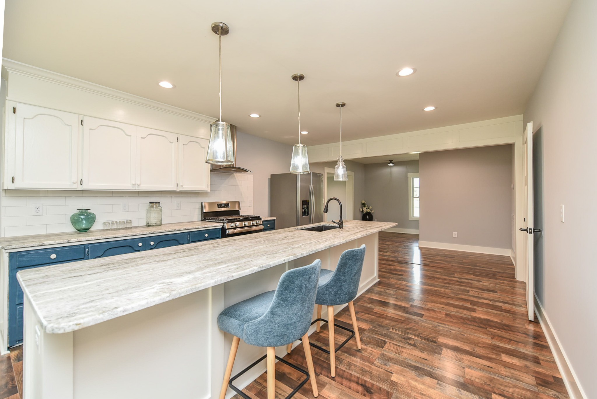 434 Fowler Ford Road Portland, TN 37148 - Photo 17 of 45 a large kitchen with kitchen island a table and chairs in it