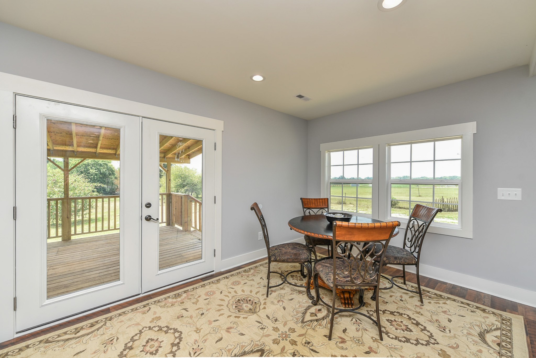 434 Fowler Ford Road Portland, TN 37148 - Photo 19 of 45 a dining room with furniture and wooden floor