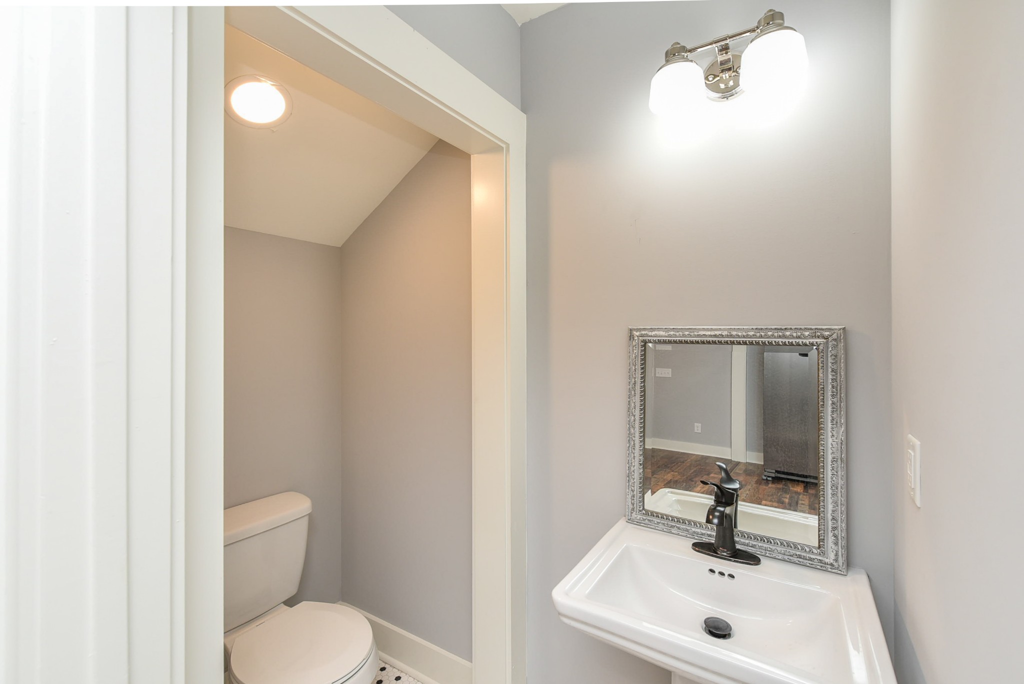 434 Fowler Ford Road Portland, TN 37148 - Photo 24 of 45 a bathroom with a toilet sink and mirror