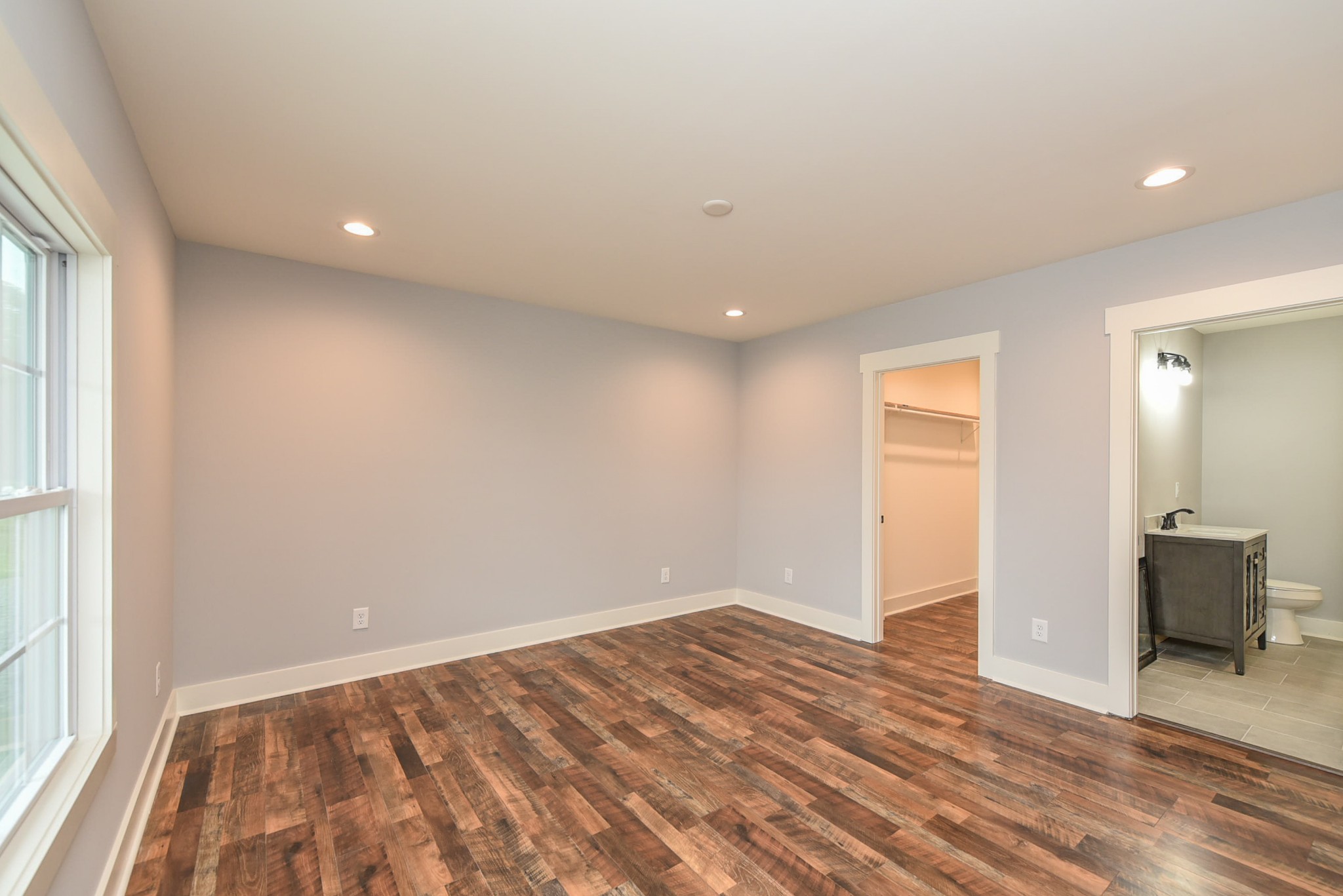 434 Fowler Ford Road Portland, TN 37148 - Photo 26 of 45 wooden floor in an empty room with a window