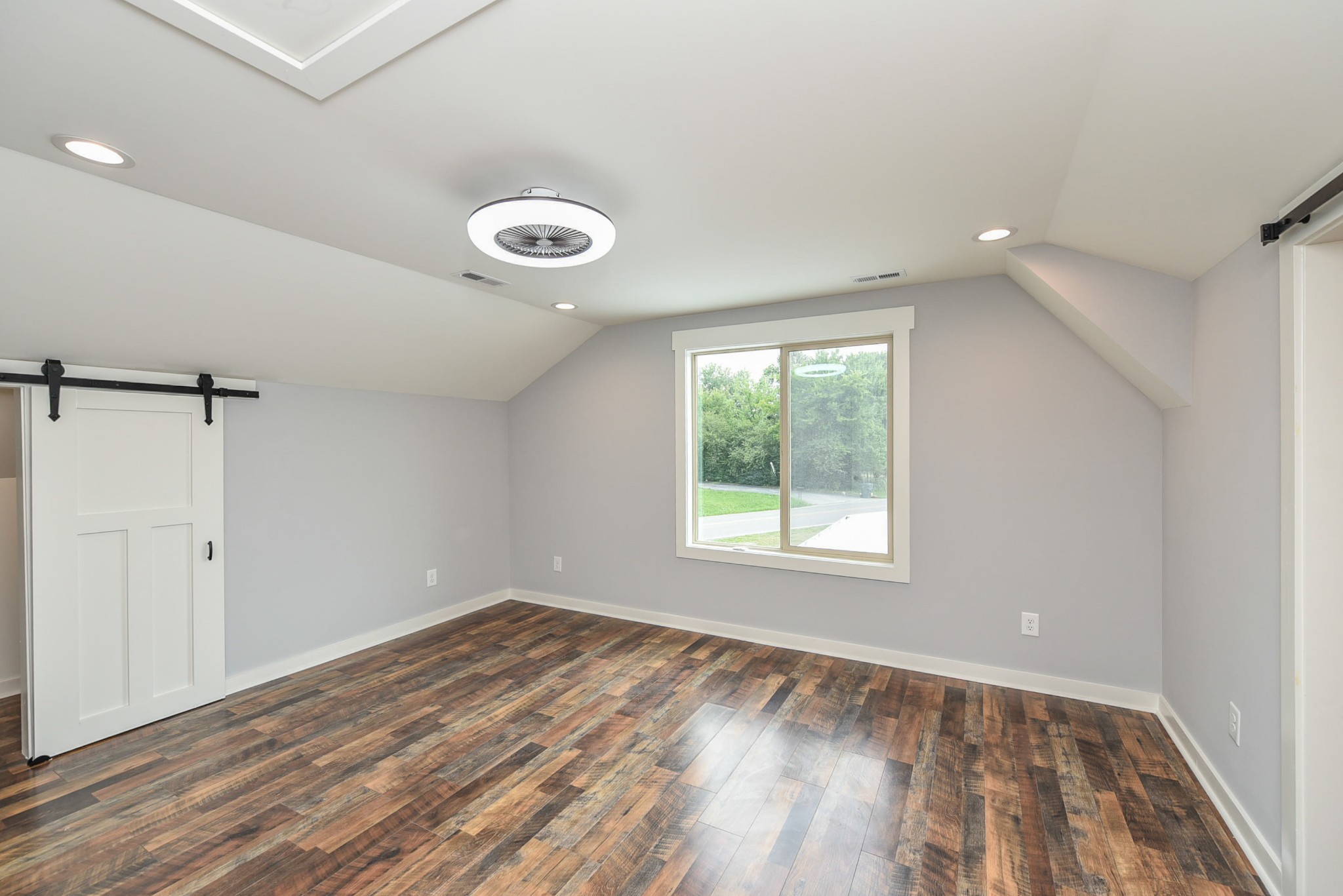 434 Fowler Ford Road Portland, TN 37148 - Photo 34 of 45 a view of empty room with wooden floor and fan