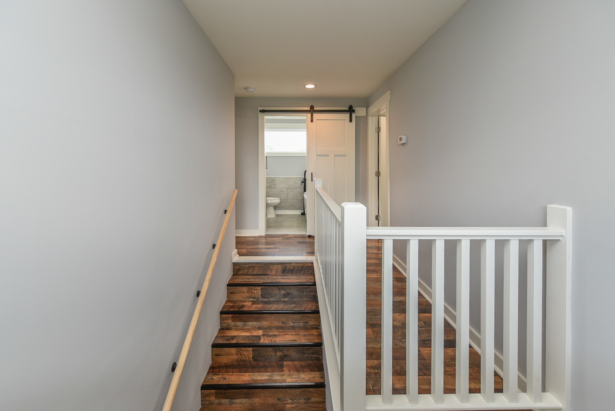 434 Fowler Ford Road Portland, TN 37148 - Photo 36 of 45 a view of staircase with wooden floor and white walls