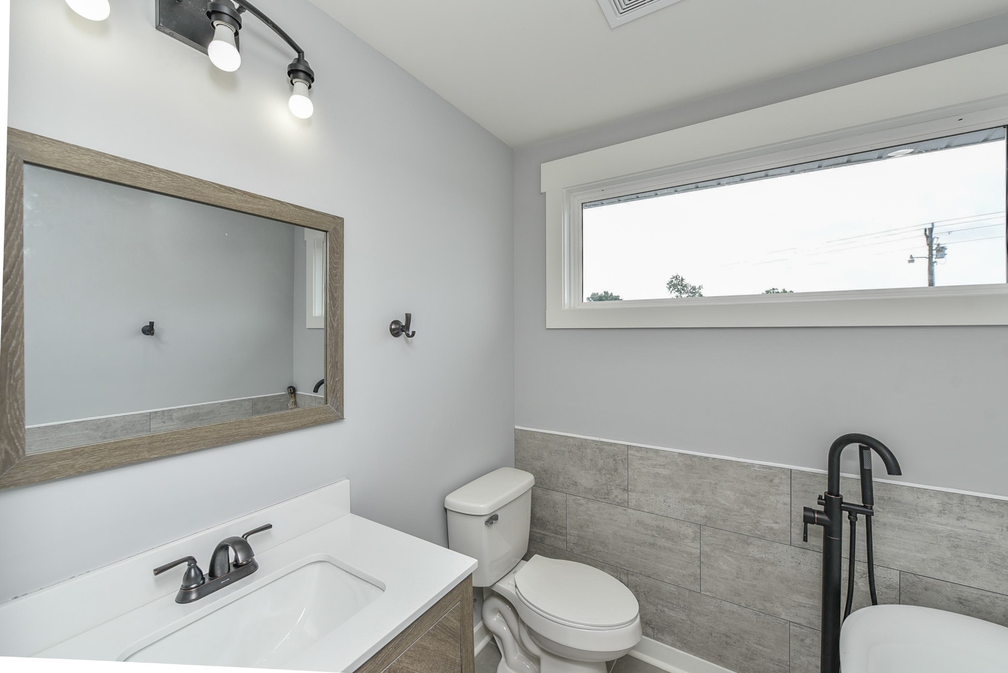 434 Fowler Ford Road Portland, TN 37148 - Photo 41 of 45 a bathroom with a sink mirror and toilet
