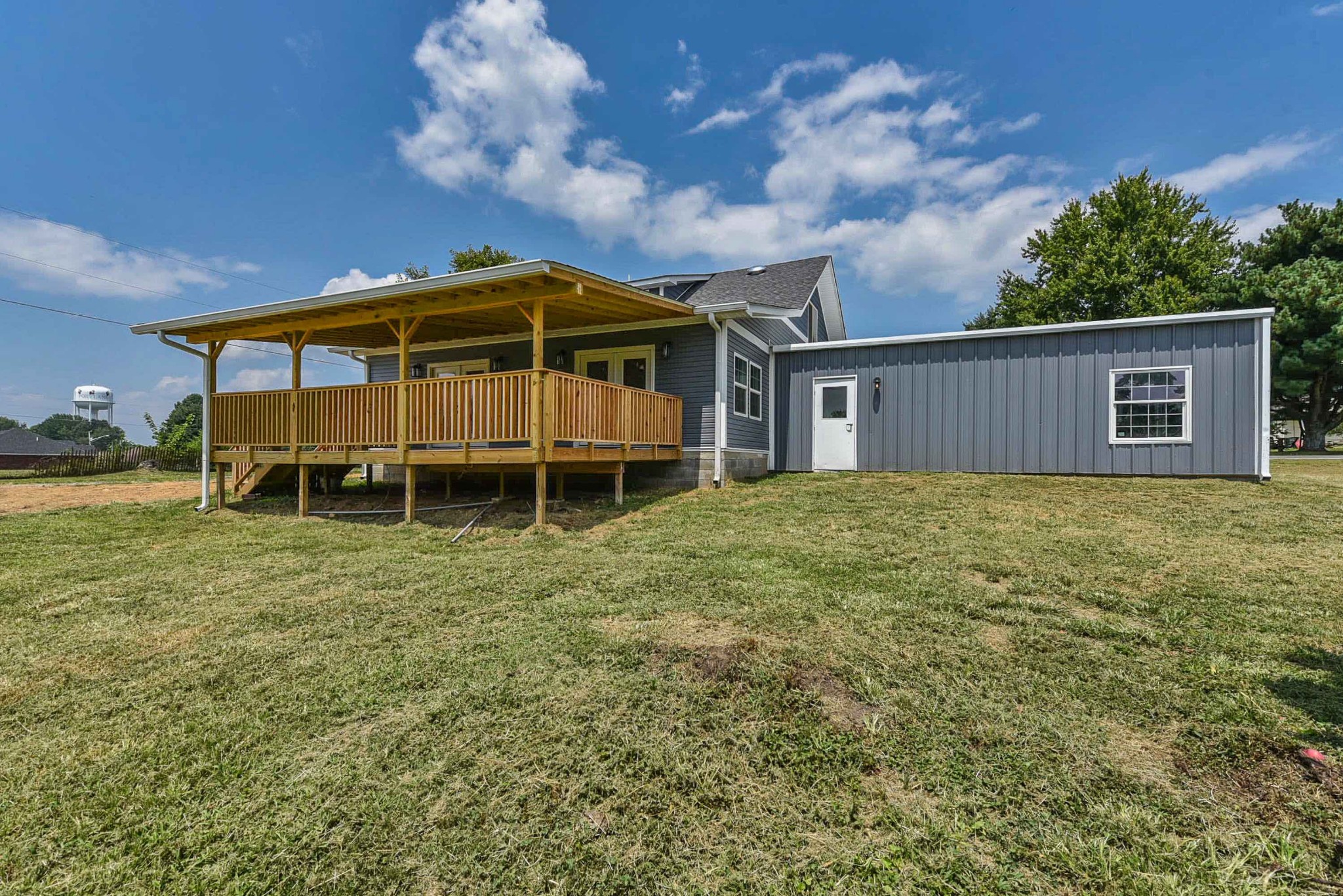 434 Fowler Ford Road Portland, TN 37148 - Photo 9 of 45 a backyard of a house with table and chairs