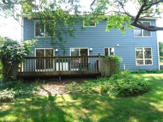 a view of a house with a yard and plants