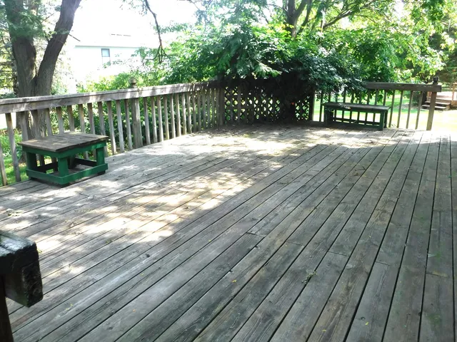 a view of balcony with wooden floor