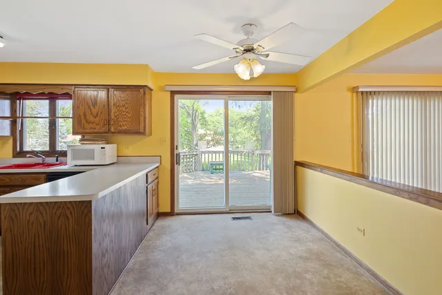 a view of a kitchen with a sink and cabinets