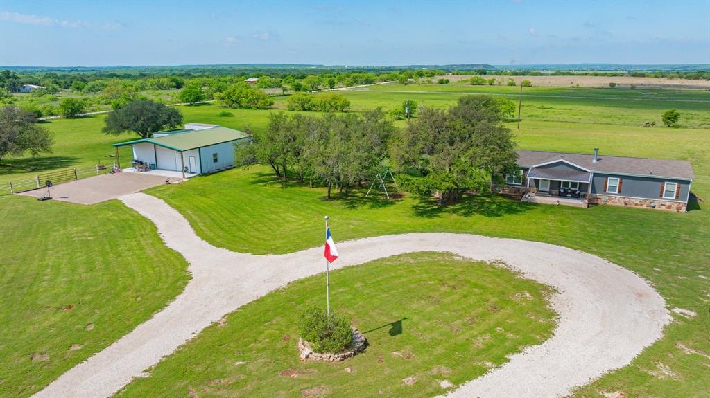 1262 Rosser Ranch Road Graham, TX 76450 - Photo 1 of 39 a view of a swimming pool with an outdoor space and seating area