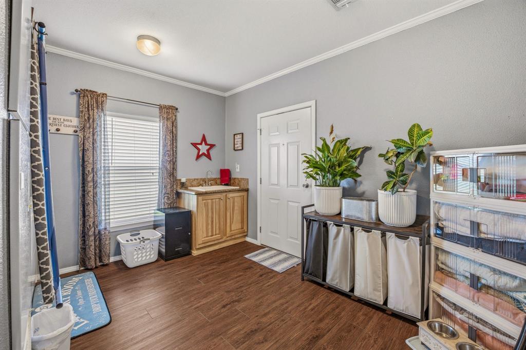 1262 Rosser Ranch Road Graham, TX 76450 - Photo 18 of 39 a white room with wooden floor and furniture