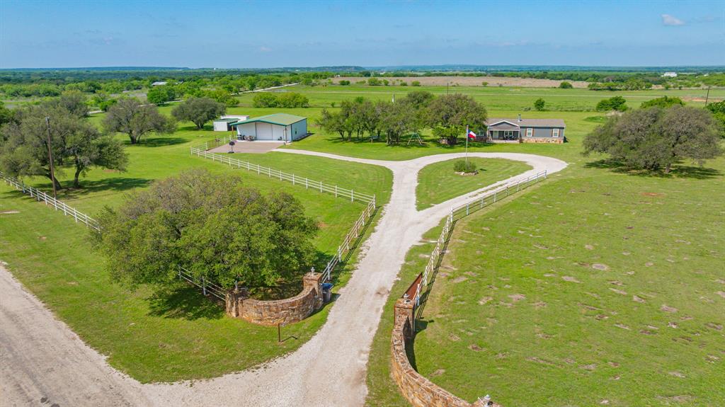1262 Rosser Ranch Road Graham, TX 76450 - Photo 30 of 39 a view of a swimming pool with a garden