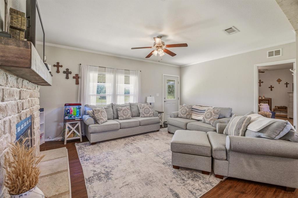 1262 Rosser Ranch Road Graham, TX 76450 - Photo 5 of 39 a living room with furniture and a fireplace