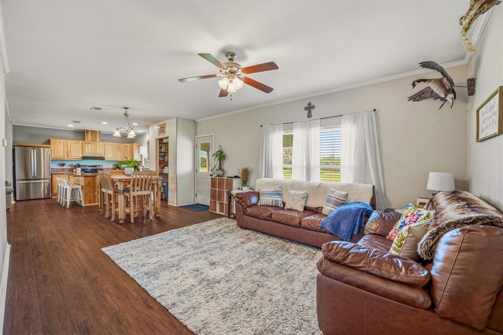 1262 Rosser Ranch Road Graham, TX 76450 - Photo 10 of 39 a living room with furniture and wooden floor