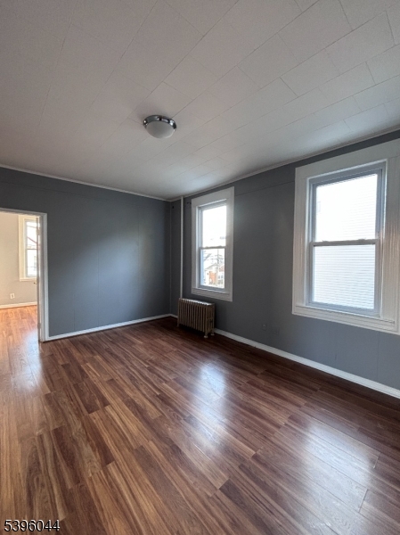 260 Pacific Street, Unit 2 Paterson, NJ 07503 - Photo 3 of 12 an empty room with wooden floor and windows