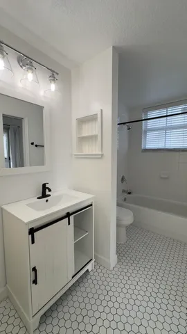 a bathroom with a sink and a toilet