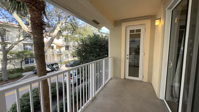 a view of a balcony with wooden floor