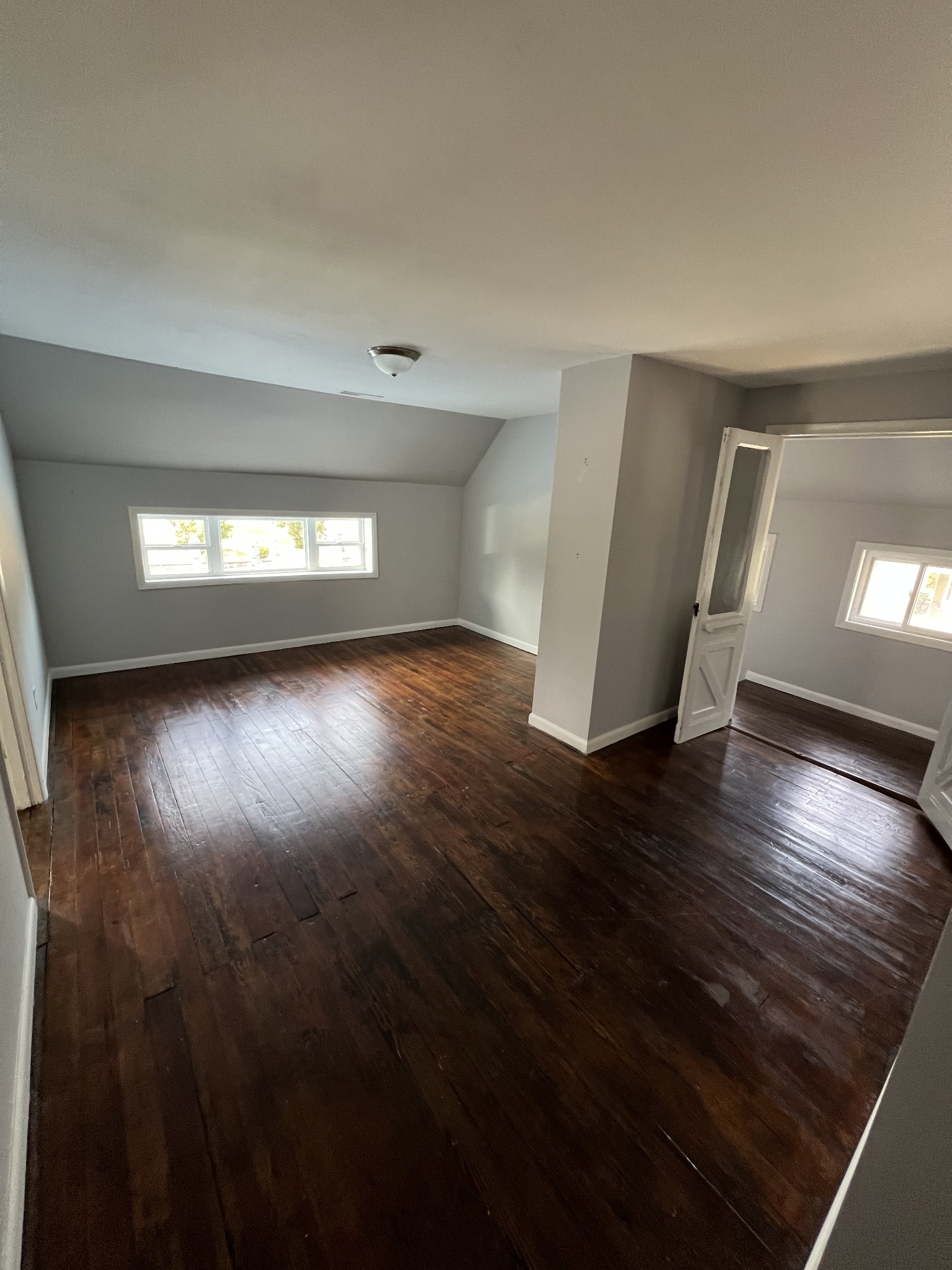 201 Pleasant Street Mount Pleasant, TN 38474 - Photo 29 of 38 an empty room with wooden floor and windows
