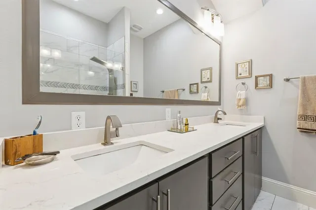 a bathroom with a sink and a mirror