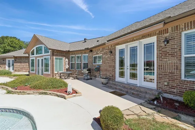 a view of a swimming pool with a lounge chair