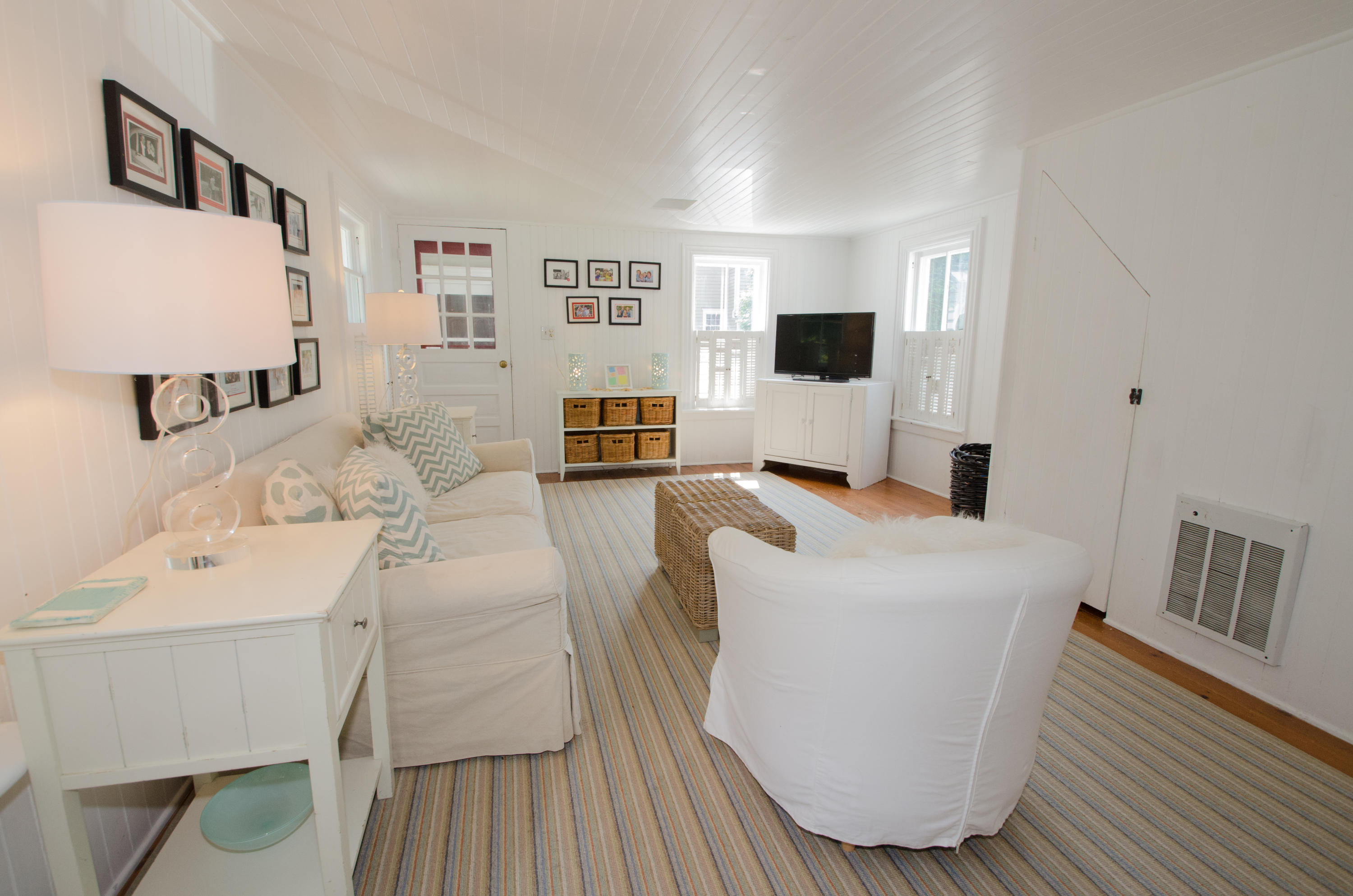 100 Hollow Tree Ridge Road Darien, CT 06820 - Photo 14 of 34 a living room with furniture and a flat screen tv