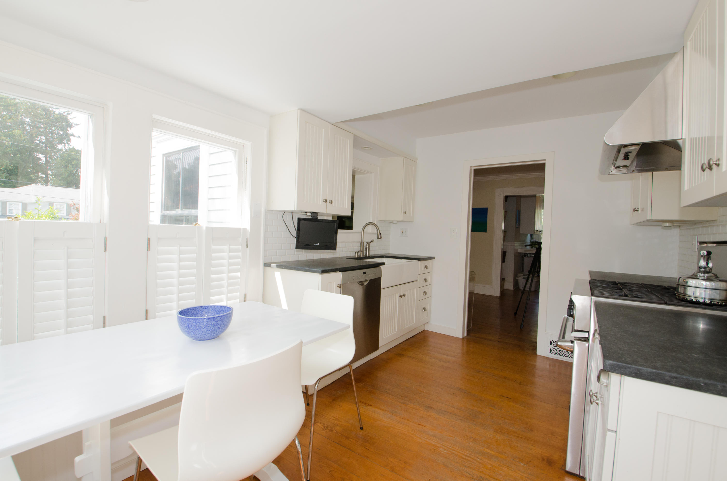 100 Hollow Tree Ridge Road Darien, CT 06820 - Photo 16 of 34 a kitchen with stainless steel appliances kitchen island granite countertop a sink and a stove
