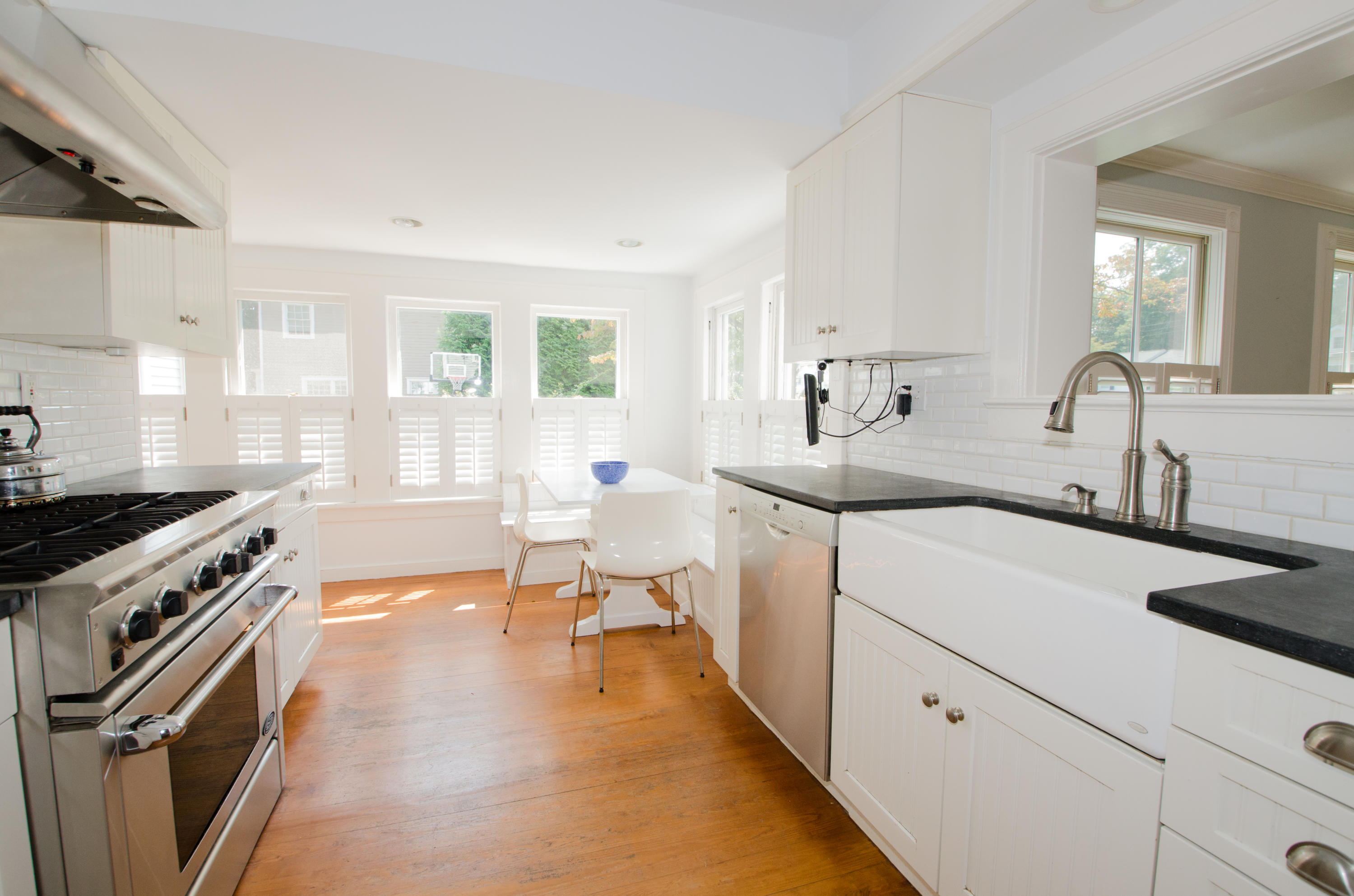 100 Hollow Tree Ridge Road Darien, CT 06820 - Photo 18 of 34 a kitchen with a sink stove and cabinets
