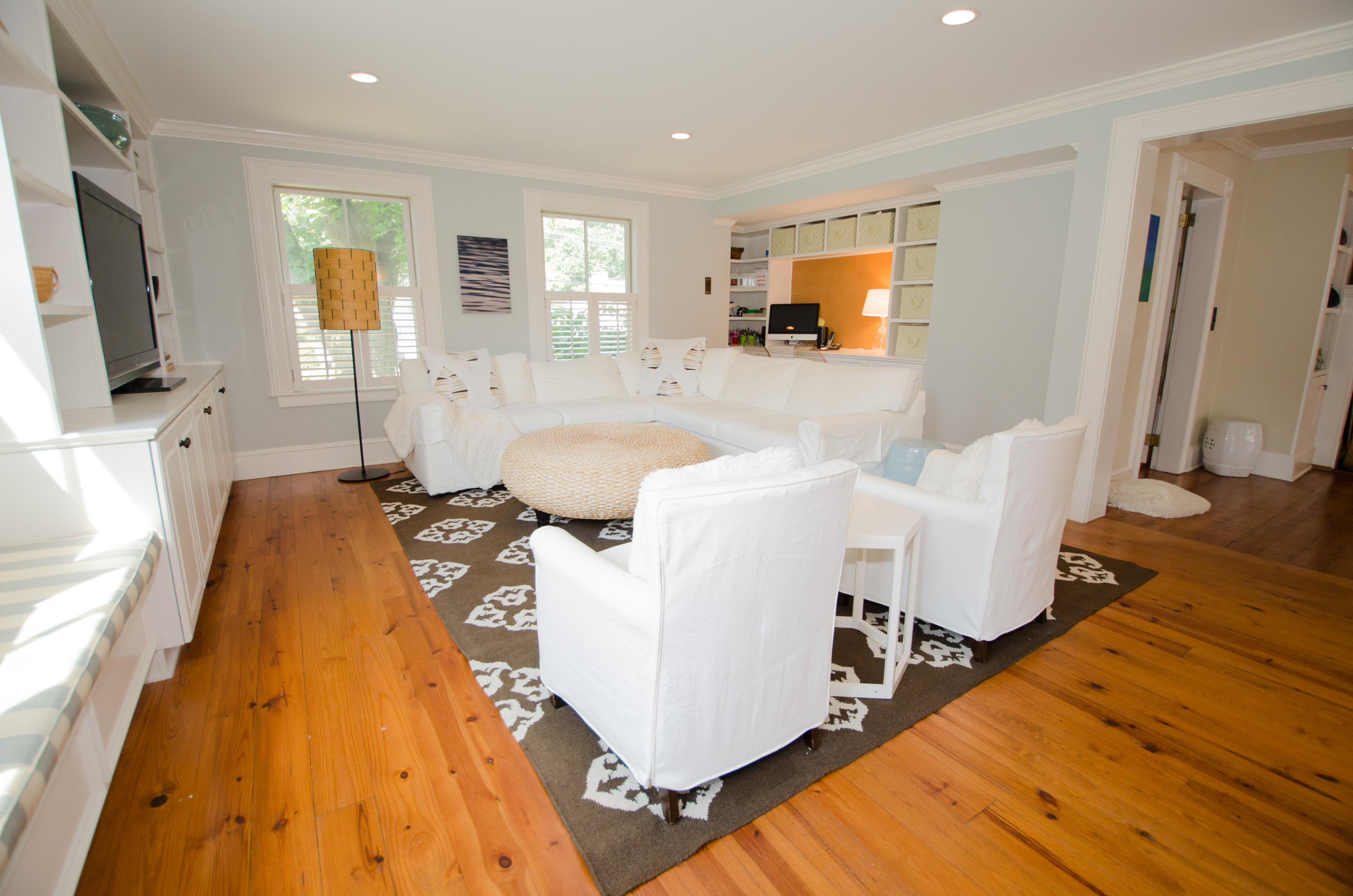 100 Hollow Tree Ridge Road Darien, CT 06820 - Photo 20 of 34 a living room with a couch and a flat screen tv