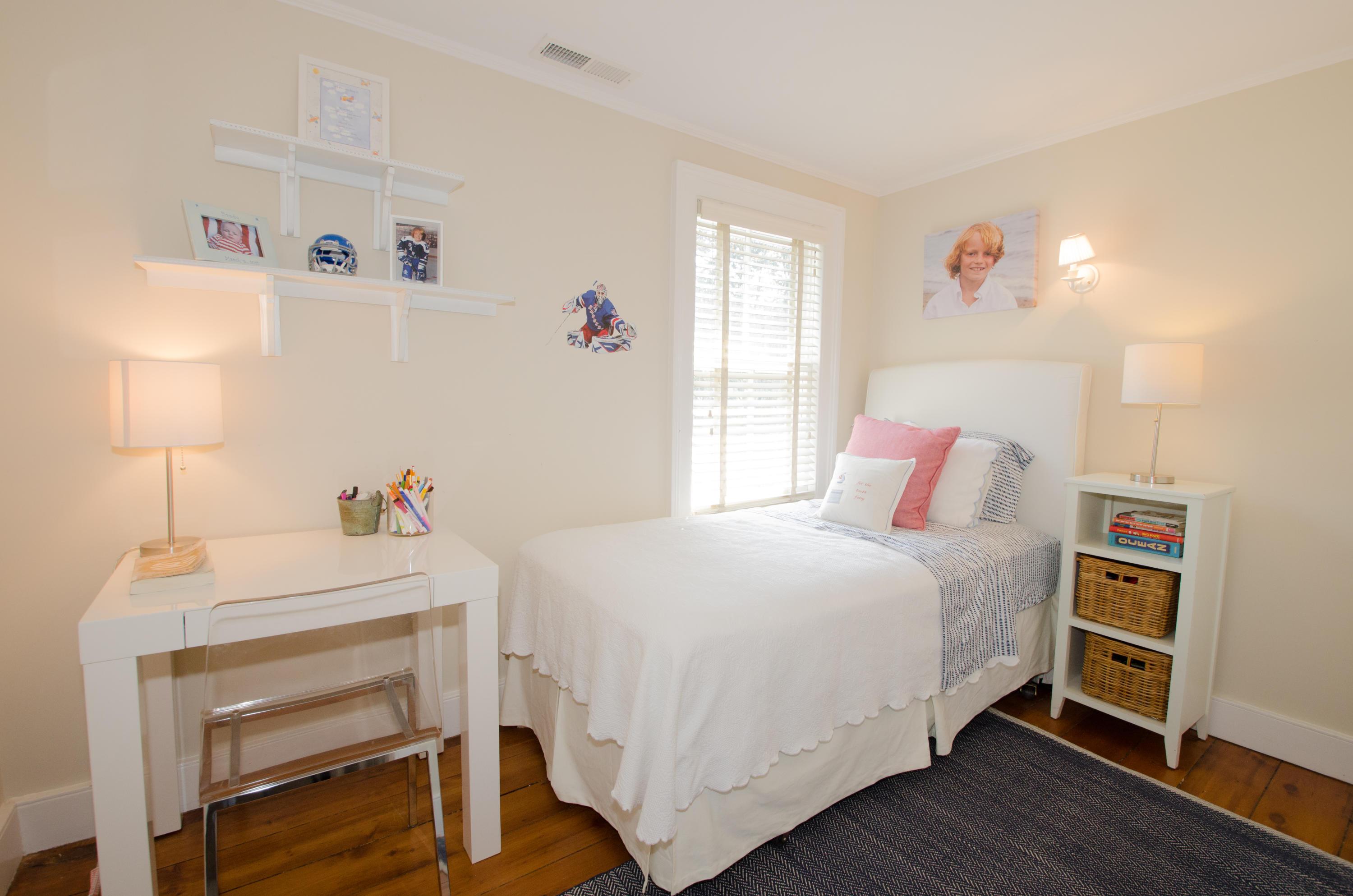 100 Hollow Tree Ridge Road Darien, CT 06820 - Photo 25 of 34 a bedroom with a bed and a table in it