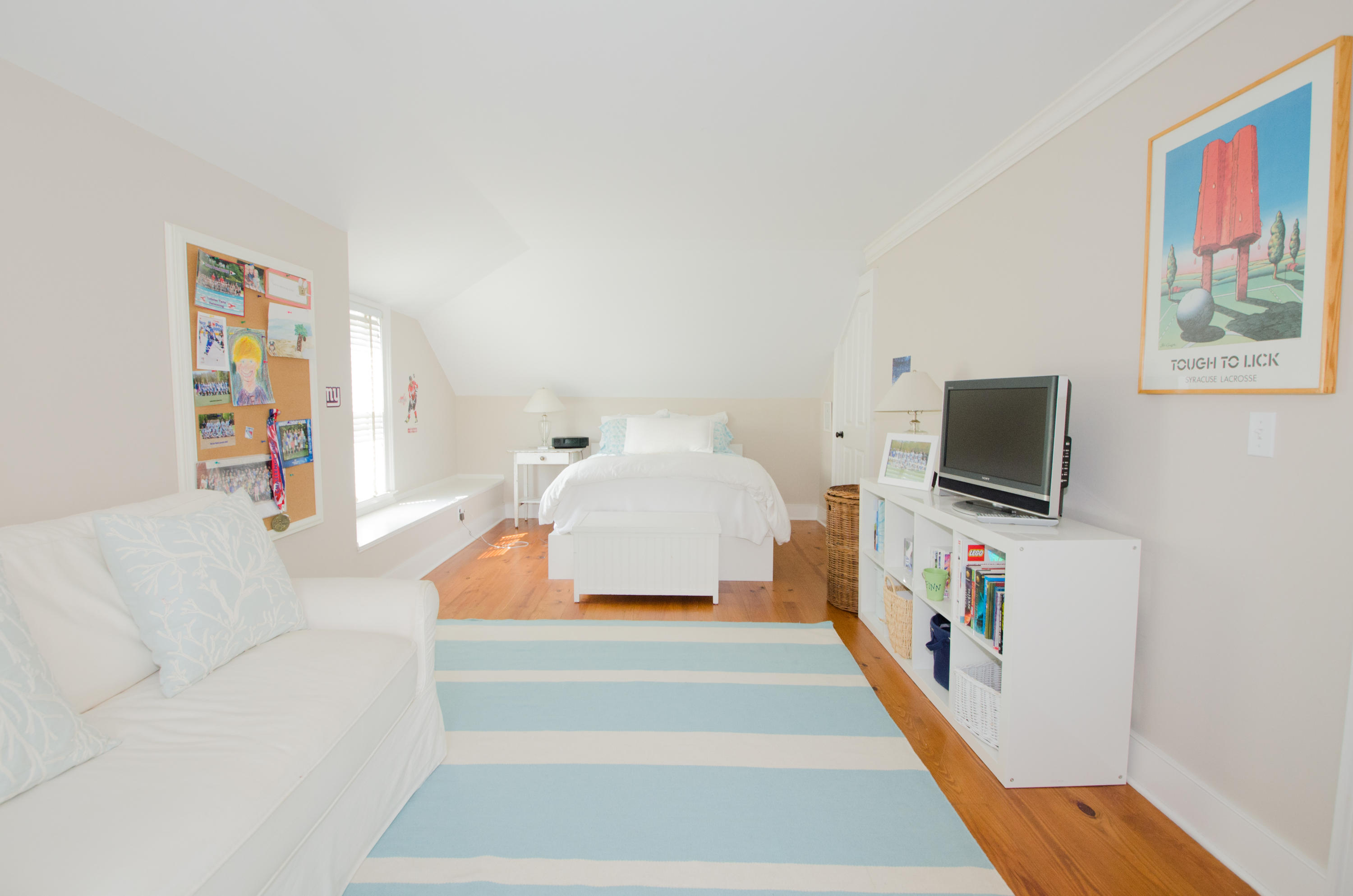 100 Hollow Tree Ridge Road Darien, CT 06820 - Photo 30 of 34 a bedroom with furniture and a flat screen tv