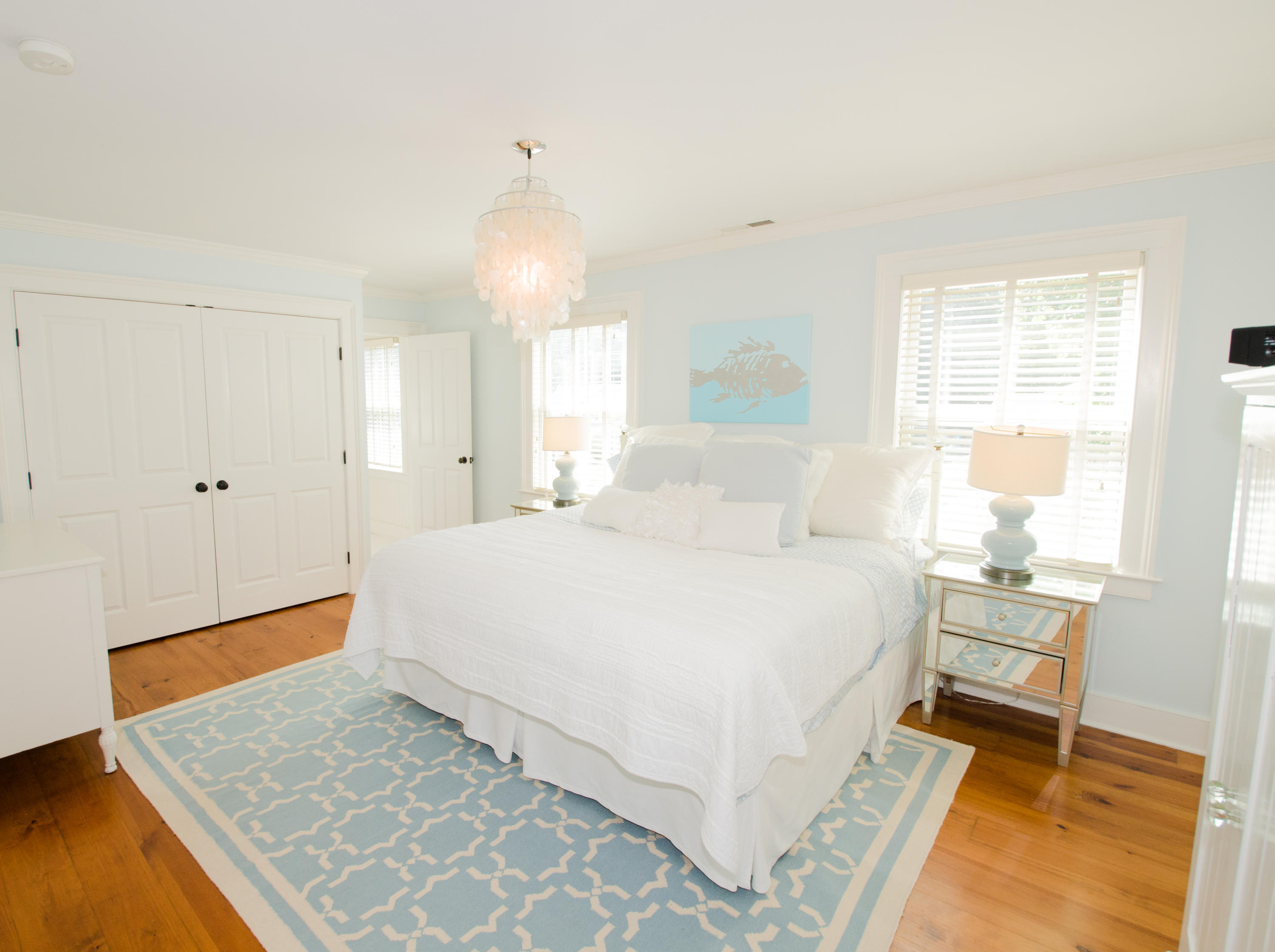 100 Hollow Tree Ridge Road Darien, CT 06820 - Photo 31 of 34 a spacious bedroom with a bed and wooden floor