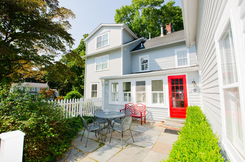 100 Hollow Tree Ridge Road Darien, CT 06820 - Photo 5 of 34 a view of a house with a backyard and sitting area