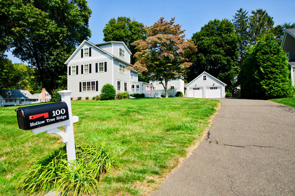 100 Hollow Tree Ridge Road Darien, CT 06820 - Photo 6 of 34 a view of a house with a yard and table and chairs