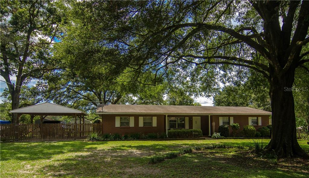 6804 Williams Road Seffner, FL 33584 - Photo 1 of 1 front view of a house with a yard